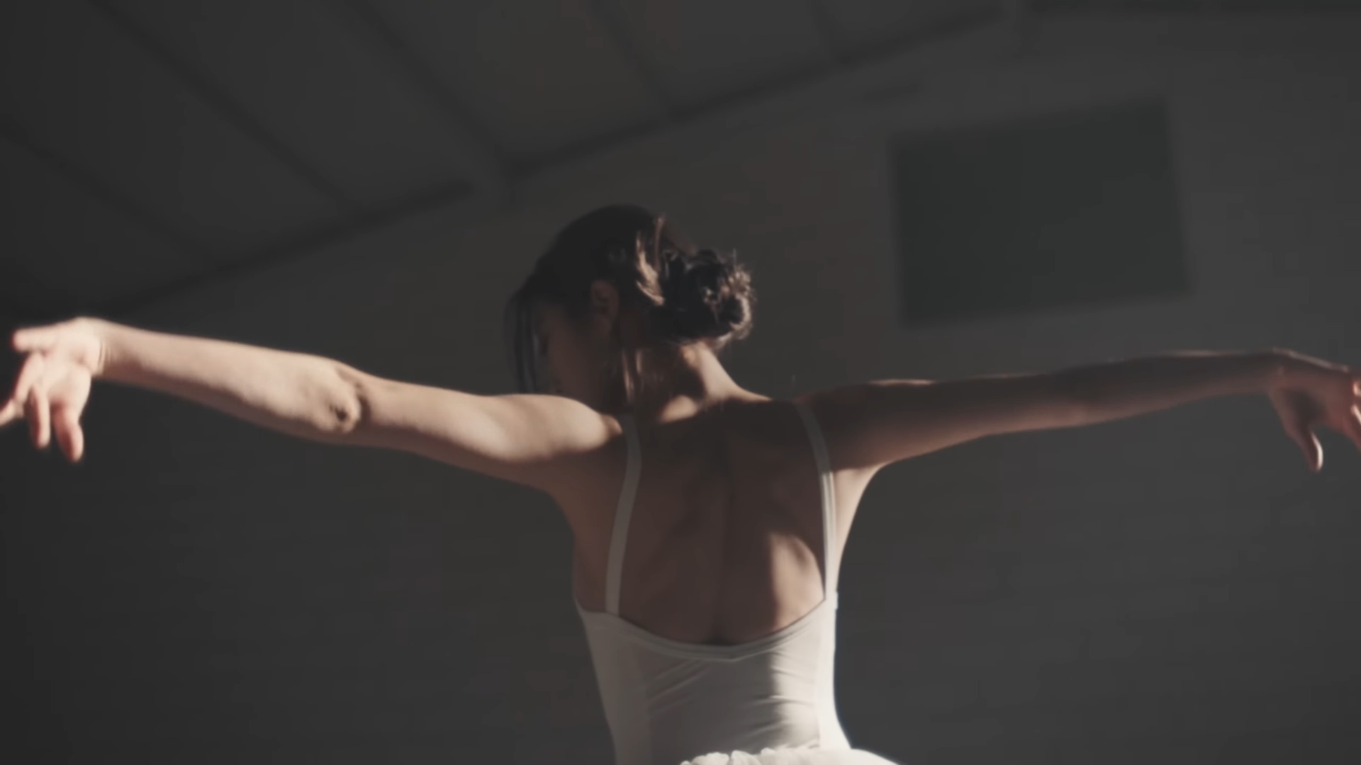 LE SSERAFIM Kazuha — a still from HYBE's official Kazuha introduction video showing her line from her ballet training years