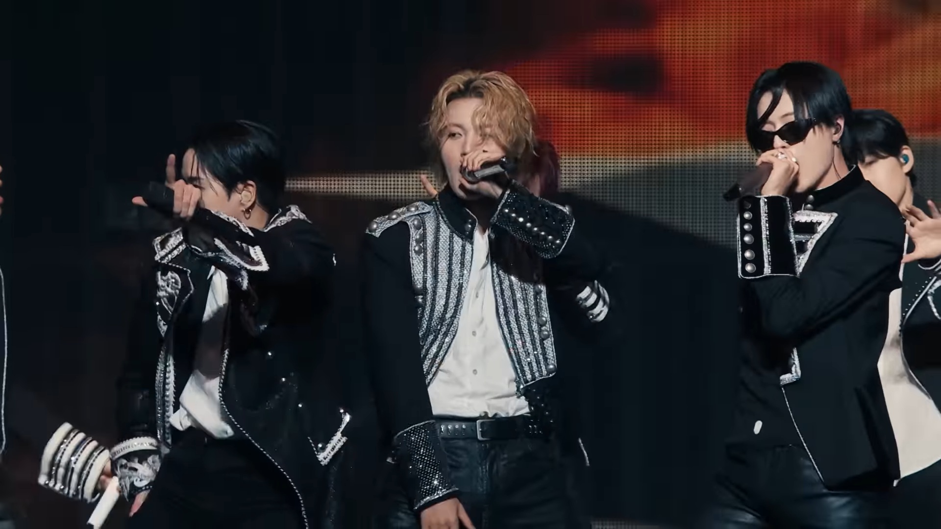 TREASURE members performing KING KONG live with hand-held microphones at PULSE ON Kanagawa