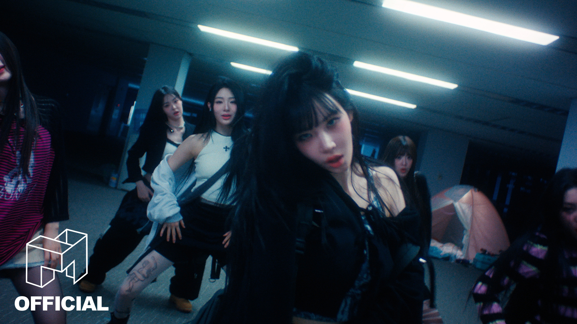 tripleS Girls Never Die music video still showing members in dark underground setting
