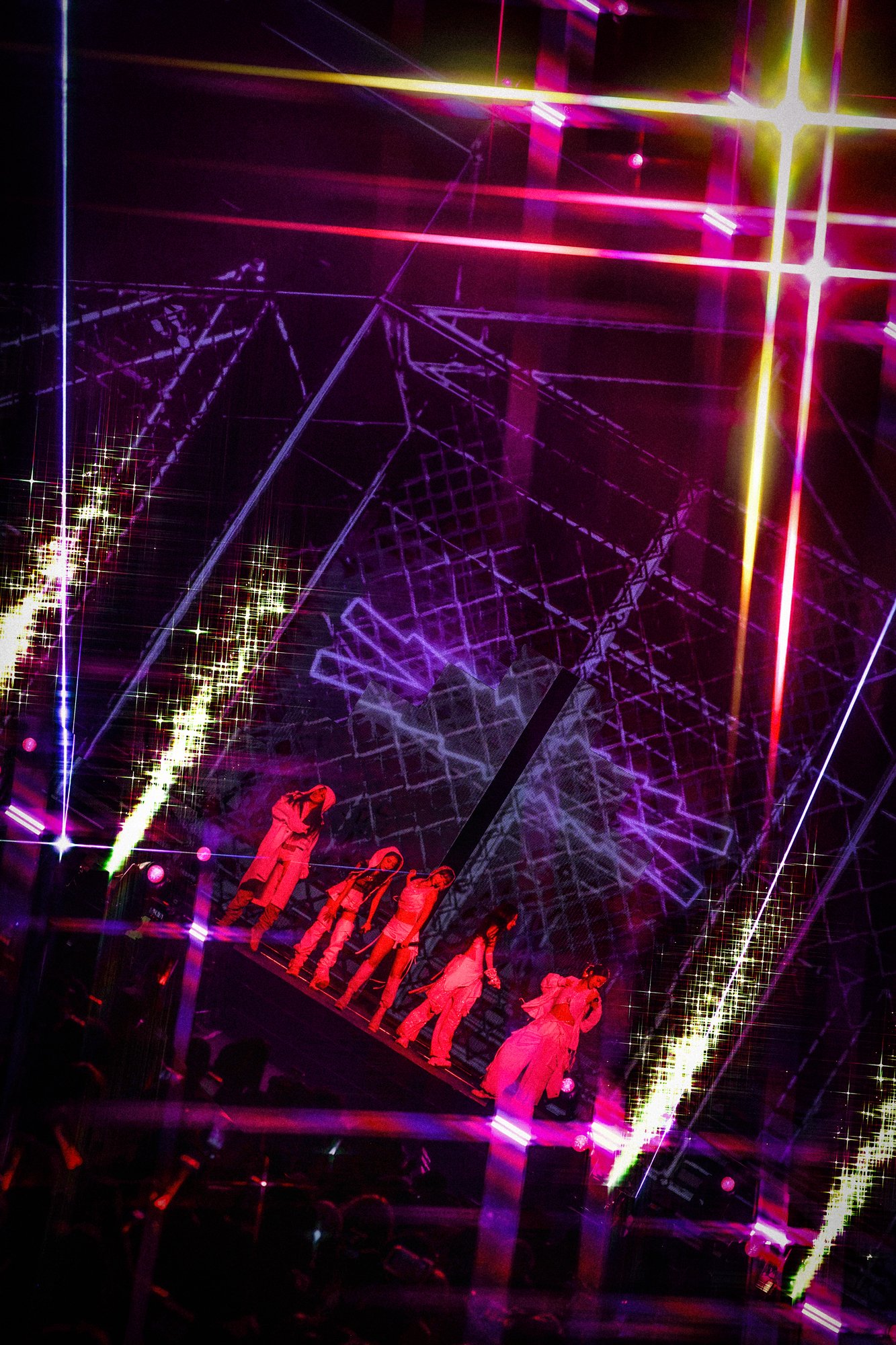LE SSERAFIM EASY CRAZY HOT World Tour in Las Vegas — wide live shot of a grid-style stage set with neon laser design