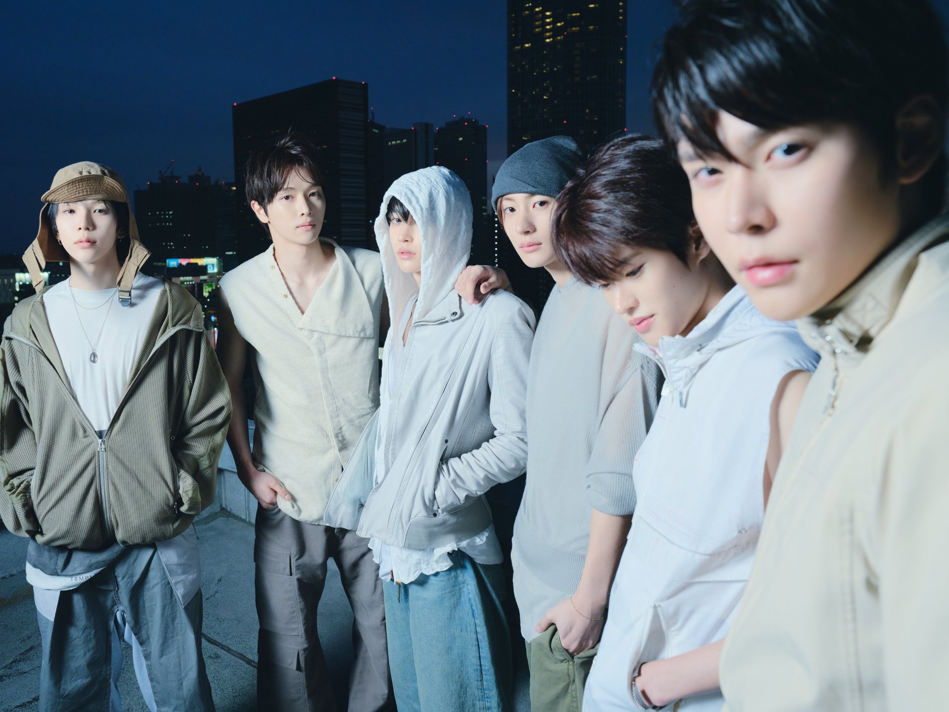 RIIZE members posing together for the second mini album II concept photo against a city night skyline