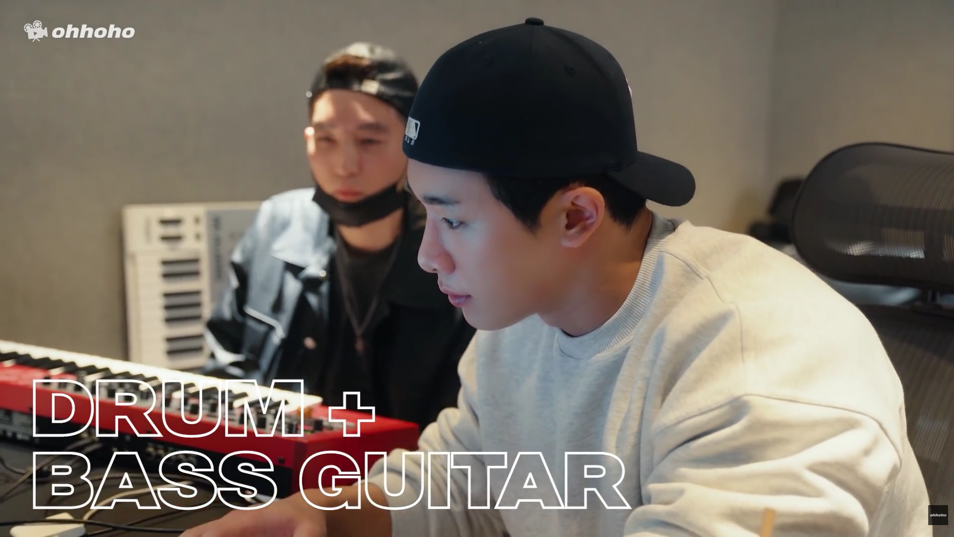 WONHO working in the studio on drums and bass guitar