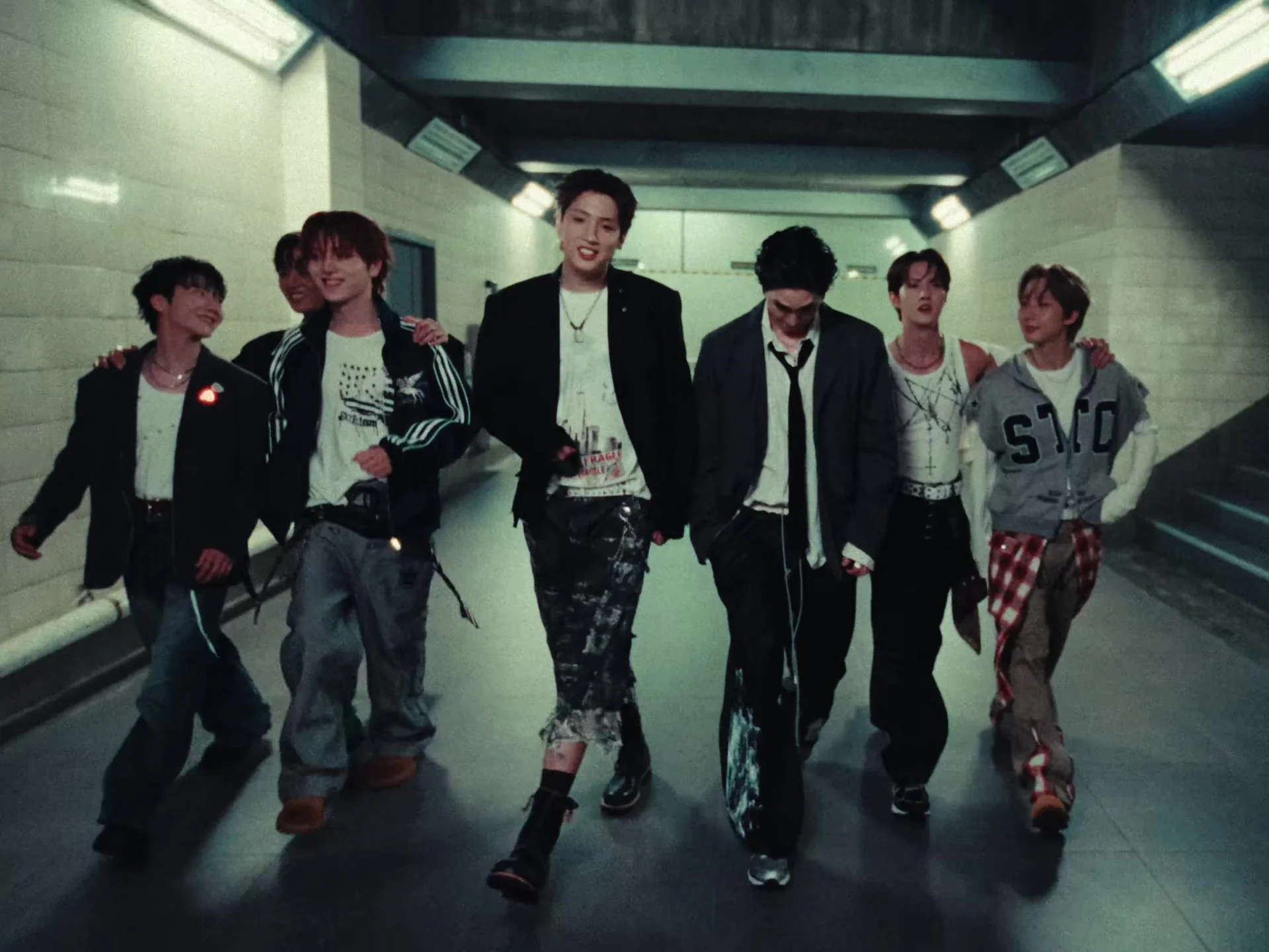 PENTAGON's seven members walking together in the Coward music video